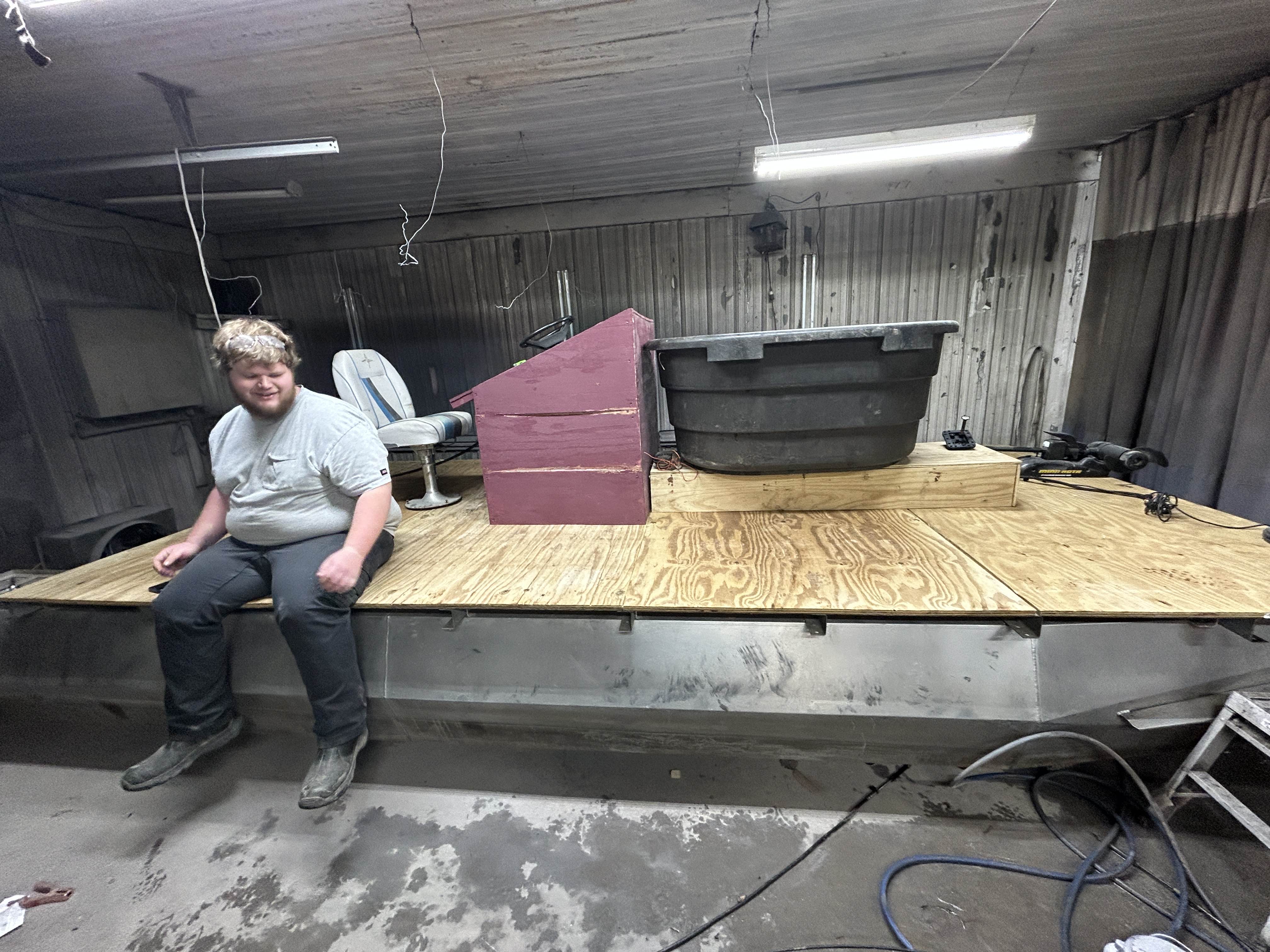 A photo of my good friend caleb salmon sitting on my boat